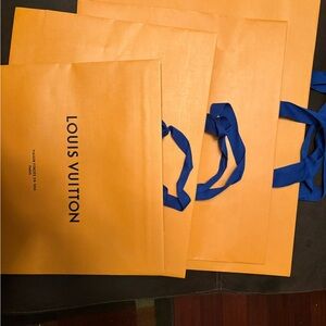 4 Louis Vuitton Orange Shopping Bags with Blue Handles